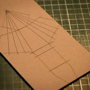 I then score lines to make it easier to bend the cardboard