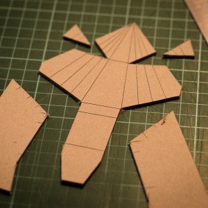 Cut out the shape to separate the excess cardboard