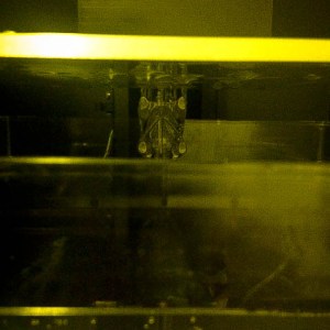 After each layer is sketched with the laser the build platform rises and dunks the print back into the resin